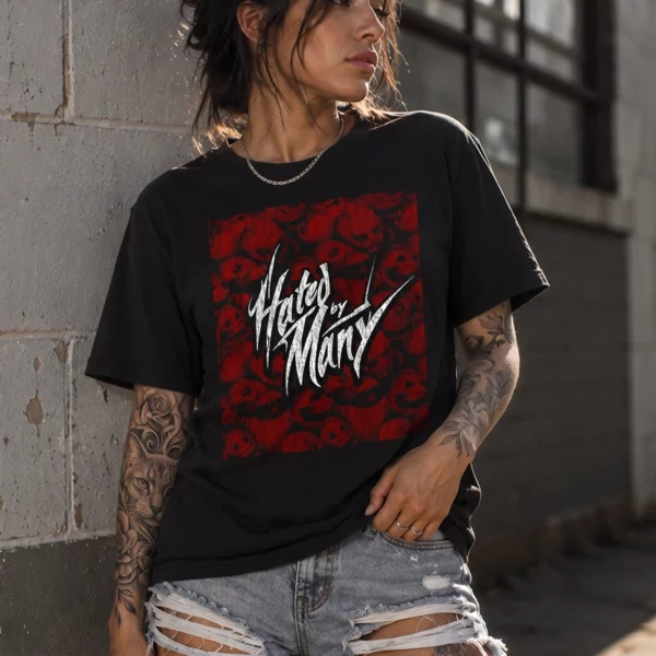Woman wearing a black t-shirt with Hated by Many in white script over a red skull graphic